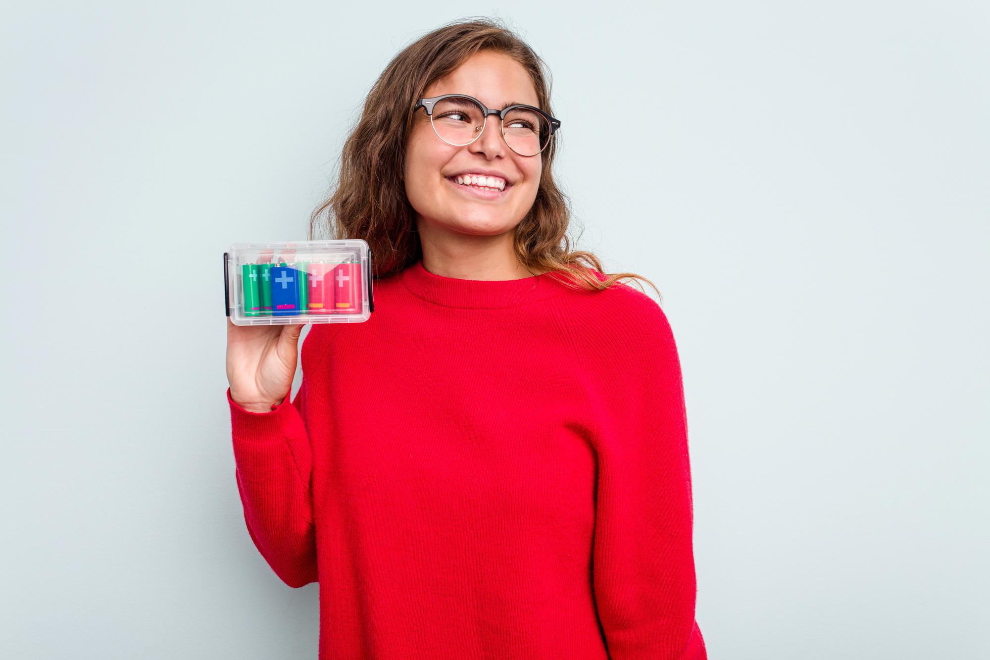 Student showing embroidered sampler